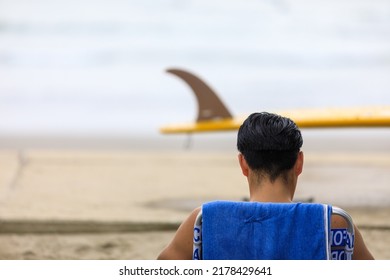 Surfers Sitting In Chairs And Taking A Break