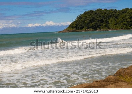 surfing with beautiful landscape and blue sky