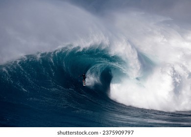 Surfing big waves at Jaws - Powered by Shutterstock