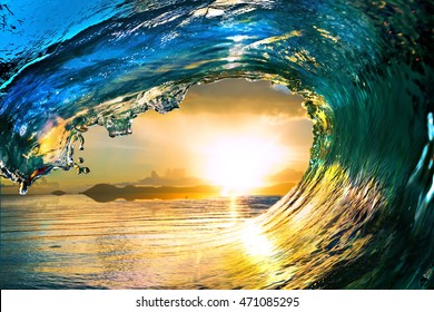 Surfing colored ocean wave falling down at sunset time