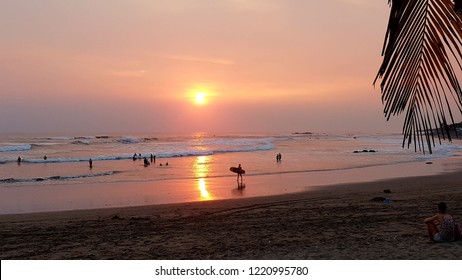 Surfing During Sunset Hour At The Pacific Coast In Las Penitas Nicaragua.