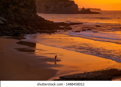 Surfing in an empty beach