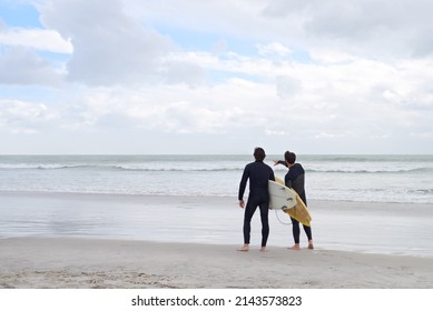 Surfing With My Best Mate. Two Young Surfers On The Beach.