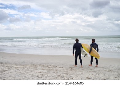 Surfing With My Best Mate. Two Young Surfers On The Beach.