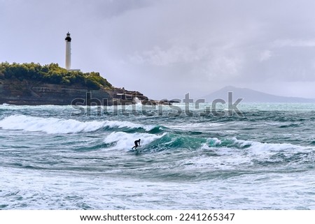 Surfing on the waves in Biarritz, France. 