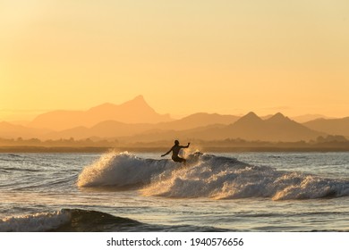 Surfing  At Sunset, Byron Bay Australia