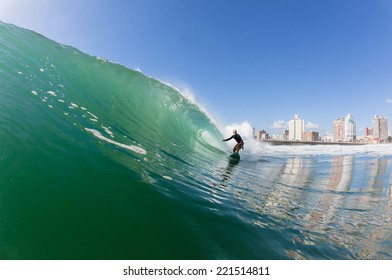 Surfing Surfer Wave  Surfing surfer rides ocean wave at North Beach Durban South Africa - Shutterstock ID 221514811