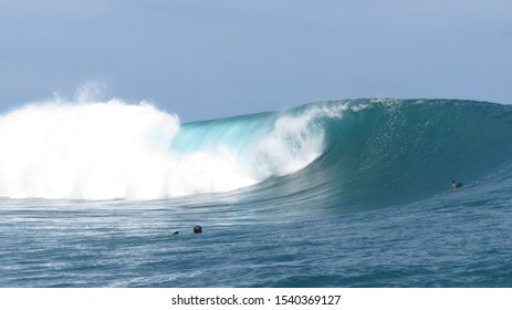 surfing the waves in tahiti