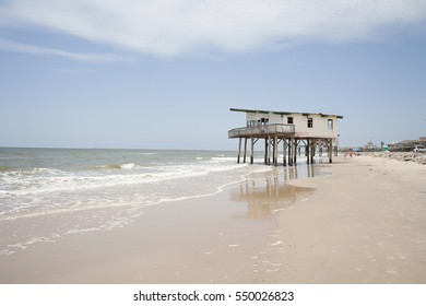 Surfside, Texas, United States - May 31st 2016: Ruined Beach House In The Surf Line From Global Warming.