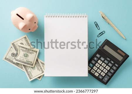 Surge in pricing and utility outlays idea. Top view snapshot of piggy bank, dollars, calculator, memo pad, pen, clips on pale blue setting with space for text or ad