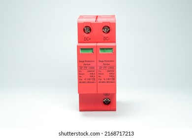 Surge Protective Device (SPD) is a tool to protect electrical installations from lightning strikes. Red DC surge arrester breaker on white background isolated.