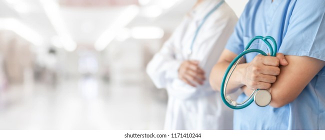 Surgeon and anesthetist doctor ER surgical team with medical clinic room background for emergency nursing care professional teamwork and patient trust in ICU hospital's hospitality concept  - Shutterstock ID 1171410244