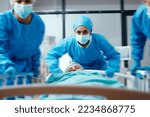 Surgeon, bed and rush in a hospital for emergency operation in the er with a sick patient. Surgery team, pushing sleeping woman and fast hospital bed in the theater for surgical medicine procedure