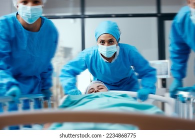 Surgeon, bed and rush in a hospital for emergency operation in the er with a sick patient. Surgery team, pushing sleeping woman and fast hospital bed in the theater for surgical medicine procedure - Powered by Shutterstock