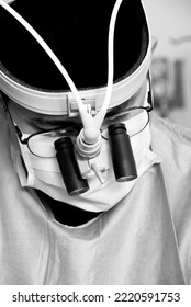 Surgeon Doctor In Surgery Room Using Magnifying Glasses For Heart Microsurgery