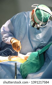 A Surgeon Doing An Open Heart Surgery In The Operation Room 