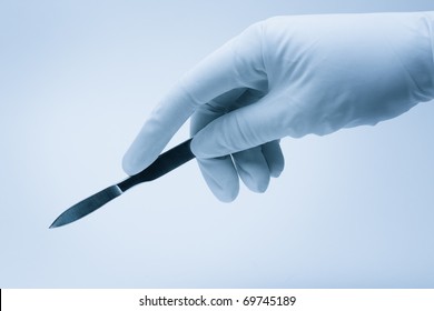 Surgeon Hand With Scalpel During Surgery