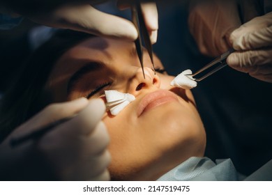 Surgeon and his assistant performing cosmetic surgery on nose in hospital operating room. Nose reshaping, augmentation. Rhinoplasty. - Shutterstock ID 2147519475