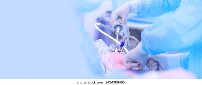 Surgeon hold surgical equipment in minimal invasive endoscopic surgery, blue light. Concept laparoscopic cholecystectomy stomach banner with copy space. - Powered by Shutterstock