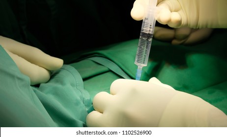 Surgeon Infiltrating Local Anaesthetic Drugs To Patient At The Beginning Of Minor Surgical Procedure