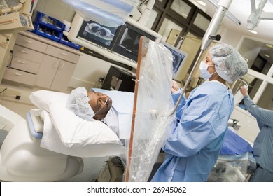 Surgeon Operating On Patient
