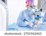 Surgeon performs eyelid blepharoplasty with microscope guidance in a sterile OR, showing precise oculoplastic technique and care.