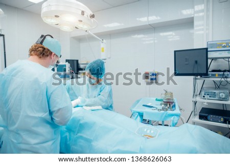 surgeon in surgery room. breast operation. mammology