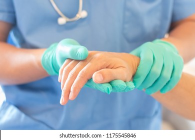Surgeon, surgical doctor, anesthetist or anesthesiologist holding patient's hand for health care trust and support in ER professional surgical operation, medical anesthetic safety, healthcare concept