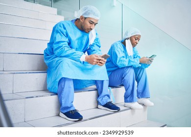 Surgeon team, stairs and phone in hospital for telehealth, healthcare or online wellness. Smartphone, doctor and people on steps on internet, reading email and medical professional research in clinic - Powered by Shutterstock