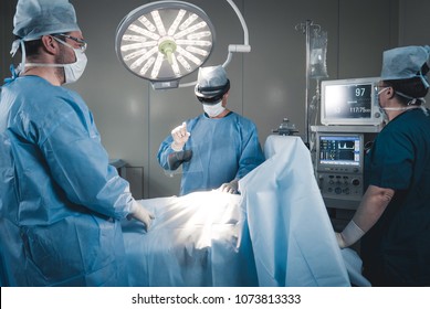Surgeon using augmented reality holographic hololens glasses, preparing for liver tumor operation