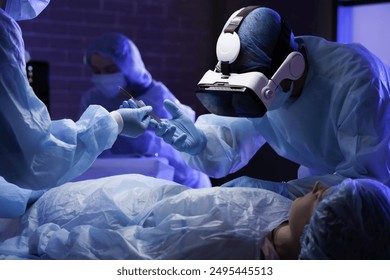 Surgeon with VR glasses taking scalpel from nurse in operating room - Powered by Shutterstock