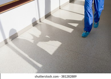 Surgeon Walking Down Corridor