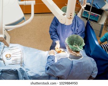 Surgeons Or Doctor Hands With Protective Glove Hold Sponge Holding A Sterilzed Gauze With Betadine Antiseptic Liquid For Skin To Clean Or Prep Wounds And Surgical Areas In Operation Room,Health Care,