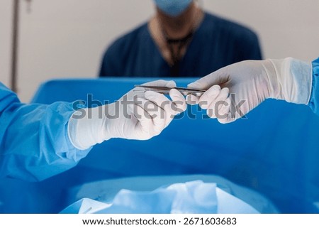 Surgeons engage in a delicate procedure while maintaining utmost precision and care