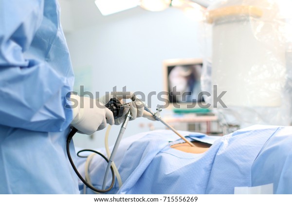 The surgeon's holing the
instrument in abdomen of patient. The surgeon's doing laparoscopic
surgery in the operating room. Minimally invasive
surgery.