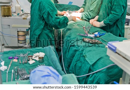 surgeons are operating in a hospital