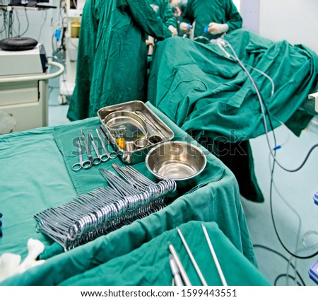 surgeons are operating in a hospital
