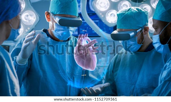 Surgeons Perform Heart Surgery Using Augmented\
Reality Technology. Difficult Heart Transplant Operation Using 3D\
Animation and Gestures. Interactive Animation Shows Vital Signs.\
Futuristic Hospital.