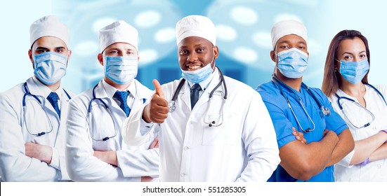 Surgeons Team In The Clear Surgical Room. Light Background