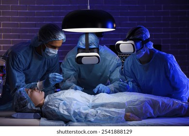 Surgeons with VR glasses operating patient in clinic - Powered by Shutterstock