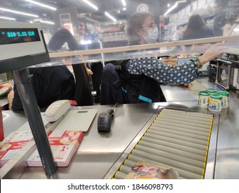 Surgeres, France - October 31, 2020:close-up Of A Supermarket Checkout With A Plexiglass Panel Serving As Protection Against Covid-19