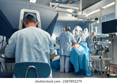 Surgery Da Vinci. Minimally invasive robotic surgery with the da Vinci surgical system. medical robot. Robotic Surgery. Robot-assisted medical operation. Medical operation involving robot.