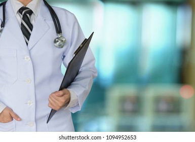 surgery doctor holding medical report folder  at the operating room. Medical concept. - Shutterstock ID 1094952653