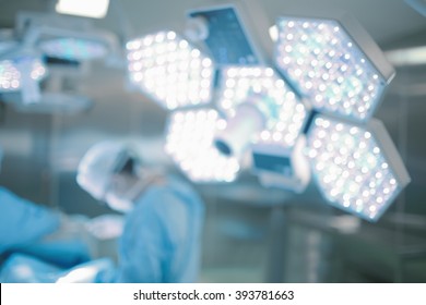 Surgery in hospital, unfocused background.