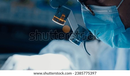 surgery with microscope glasses, neurosurgery.