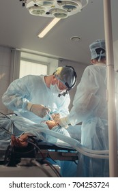 Surgery team operating nose in a surgical room - Shutterstock ID 704253724