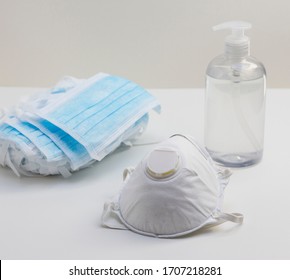 Surgical face mask, protective N95 respirator and antibacterial hand sanitizer gel. Medical supplies for corona virus prevention. - Shutterstock ID 1707218281