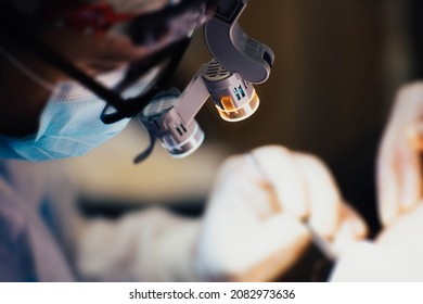 surgical flashlight on the surgeon's face, the concept of professional surgical equipment. - Powered by Shutterstock