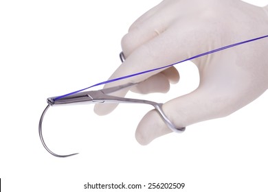 Surgical  Forceps  Holding A Suture Needle