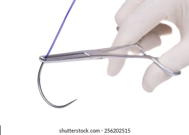 Surgical  Forceps  Holding A Suture Needle